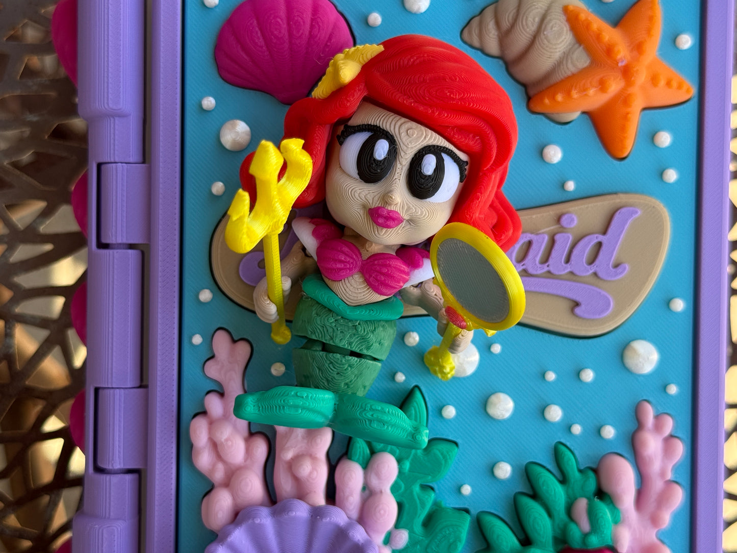 3d printed book with a 3d printed mermaid articulated figurine 