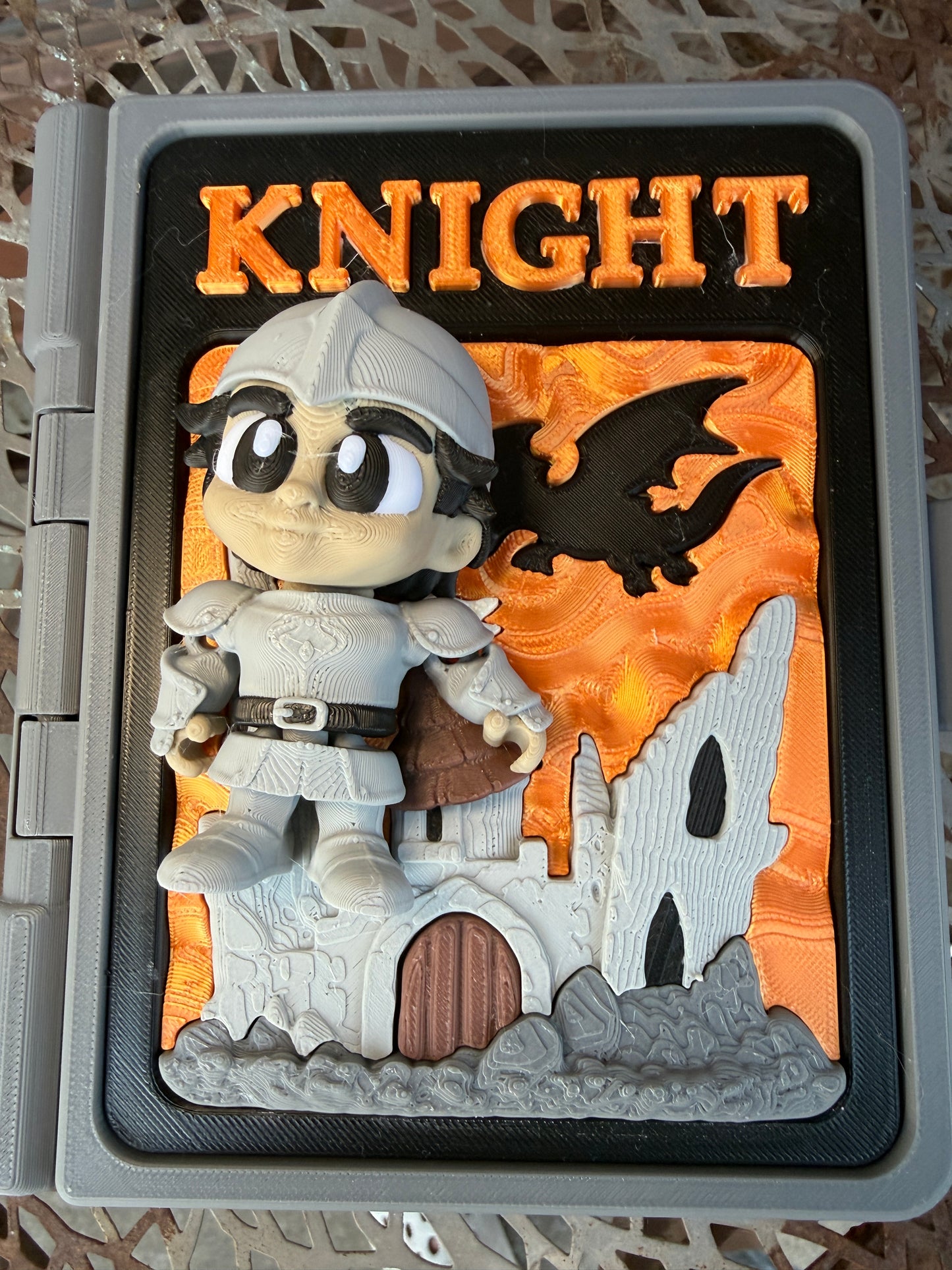 Toy knight figure in a display case with 'Knight' text on an orange background