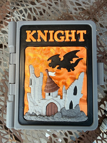 Decorative box with 'KNIGHT' text and castle design on an orange background
