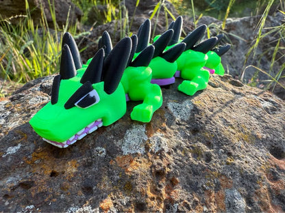 3d printed mini dragon-Hulk like features on a rocky surface