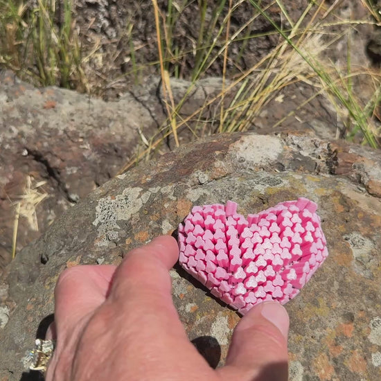 video with pink heart articulated moving and shacking